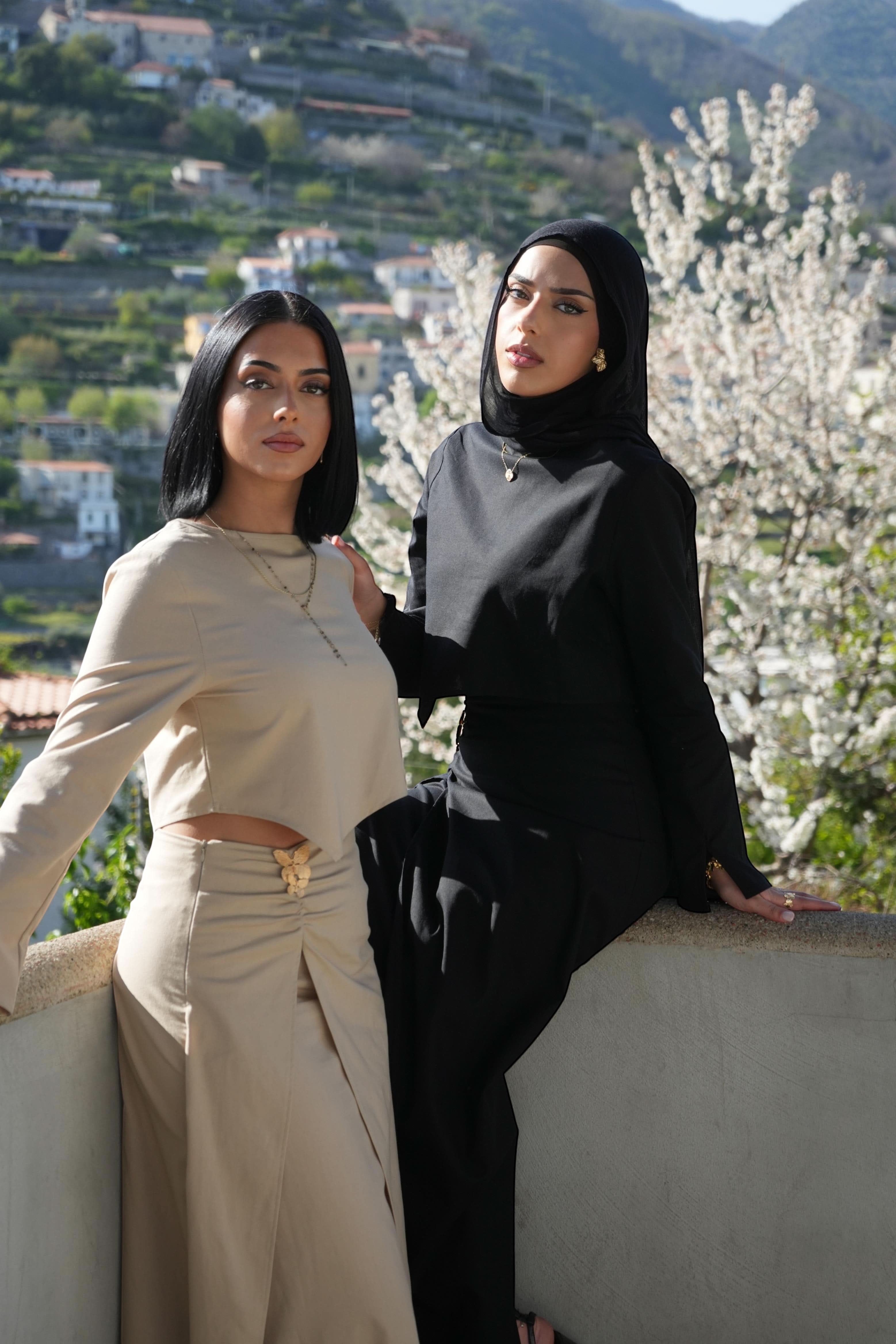 Two models wearing LOSYANA Mediterrance Serenity sets in beige and black, featuring breathable linen-cotton fabric.