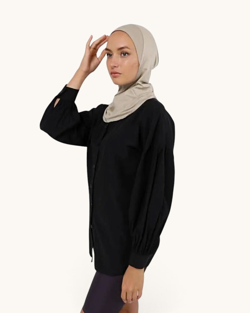 LOSYANA ninja underscarf in bone beige worn by a model in a black button-down shirt