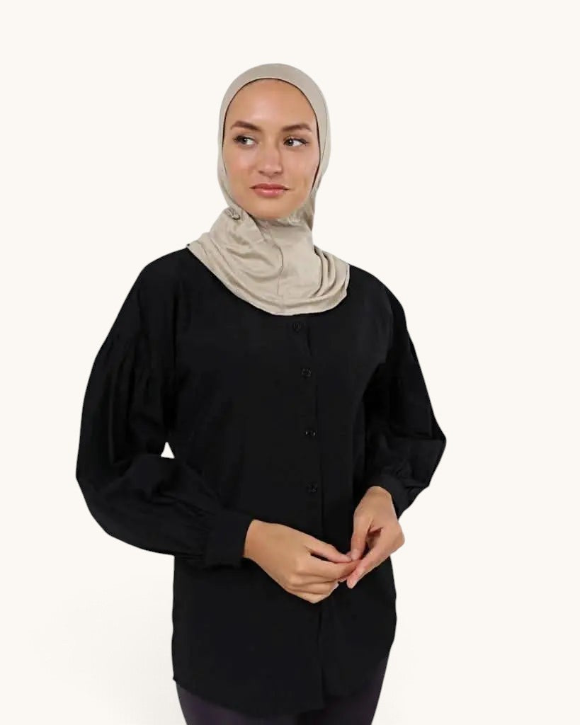 LOSYANA ninja underscarf in bone beige worn by a model in a black button-down shirt against a white background