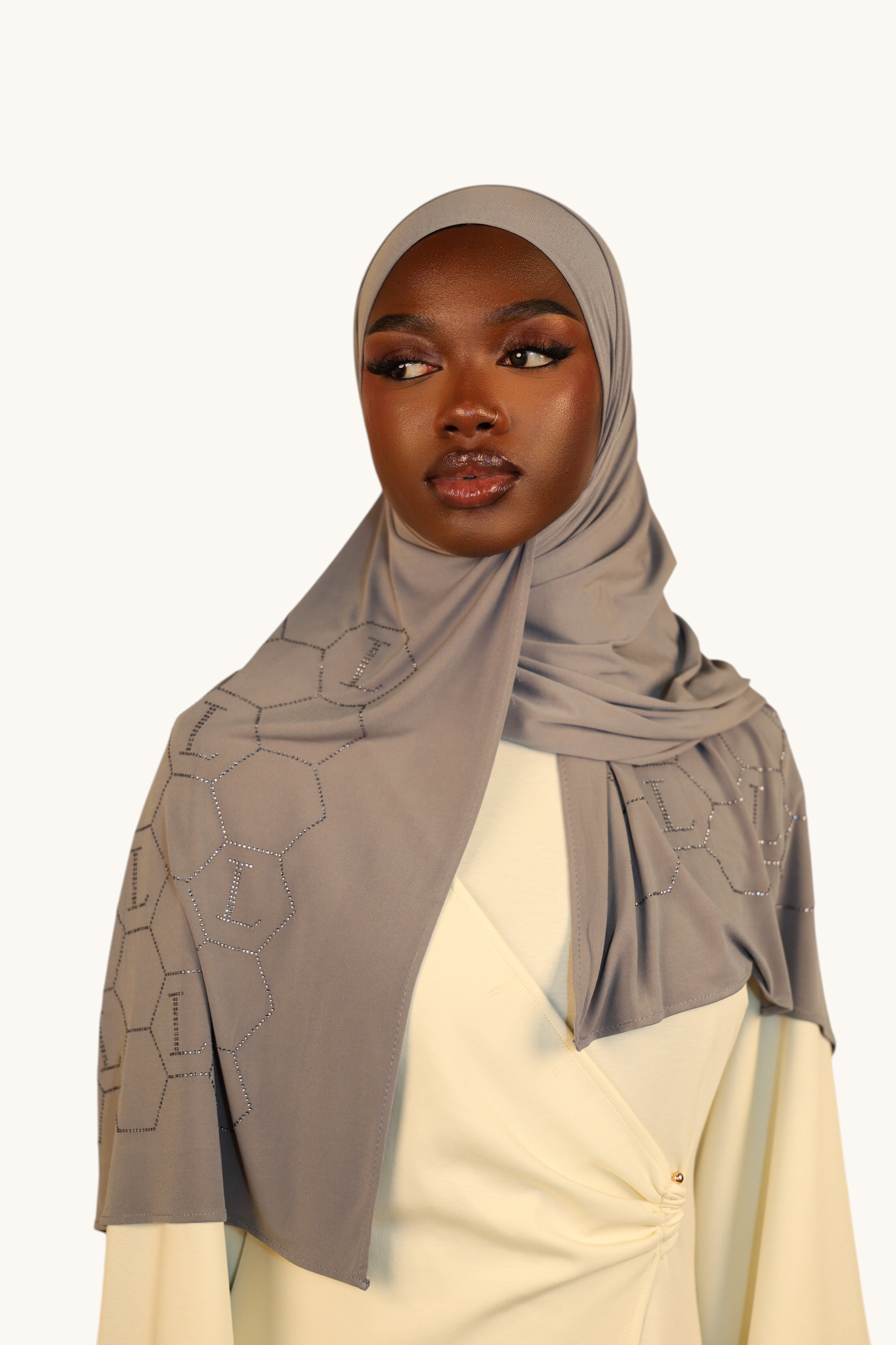 LOSYANA nude grey premium jersey hijab with sparkling rhinestone L-pattern detail worn by a model