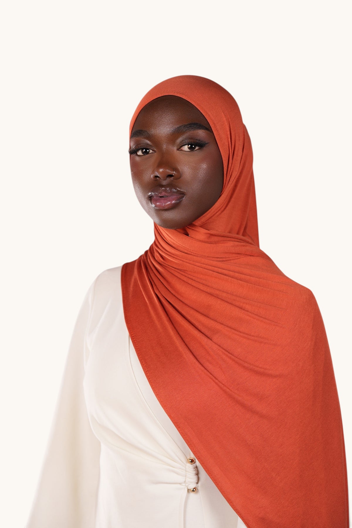 LOSYANA papaya bamboo jersey hijab worn by a model in a soft, lightweight, and flowing fabric