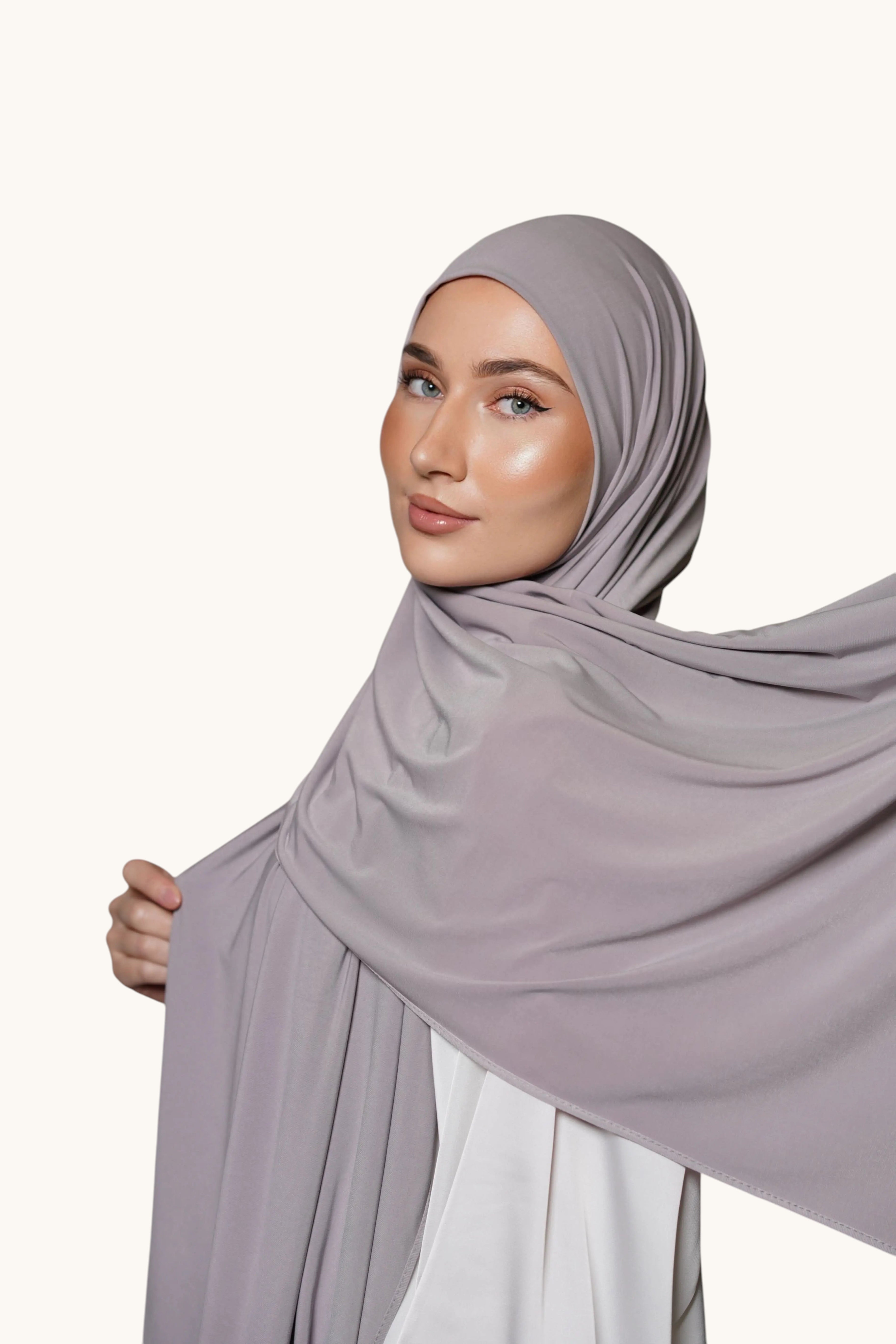 LOSYANA premium grey jersey hijab worn by a woman, featuring soft, non-transparent, and non-slip fabric.
