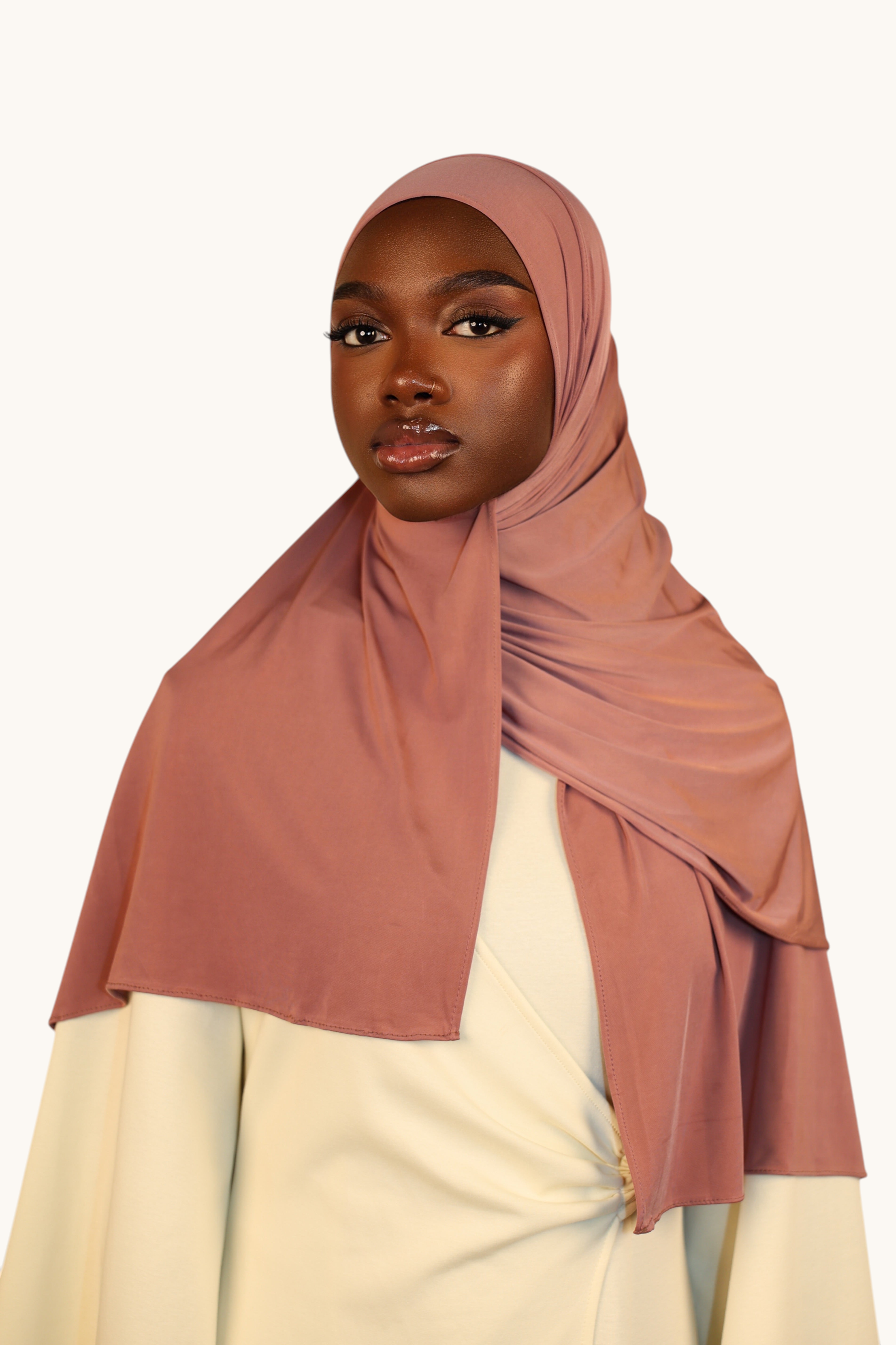 Model wearing a LOSYANA Liquid Jersey hijab in rosewood, featuring a lightweight, elegant, and soft satin-like finish.