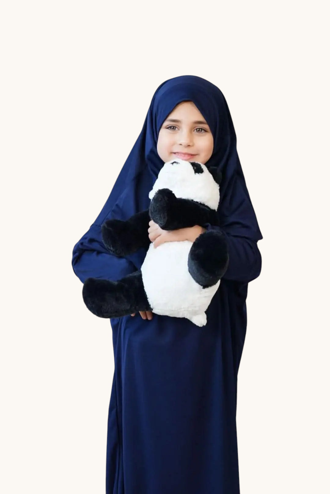 Young girl wearing a royal blue LOSYANA jersey prayer dress while holding a plush panda toy.