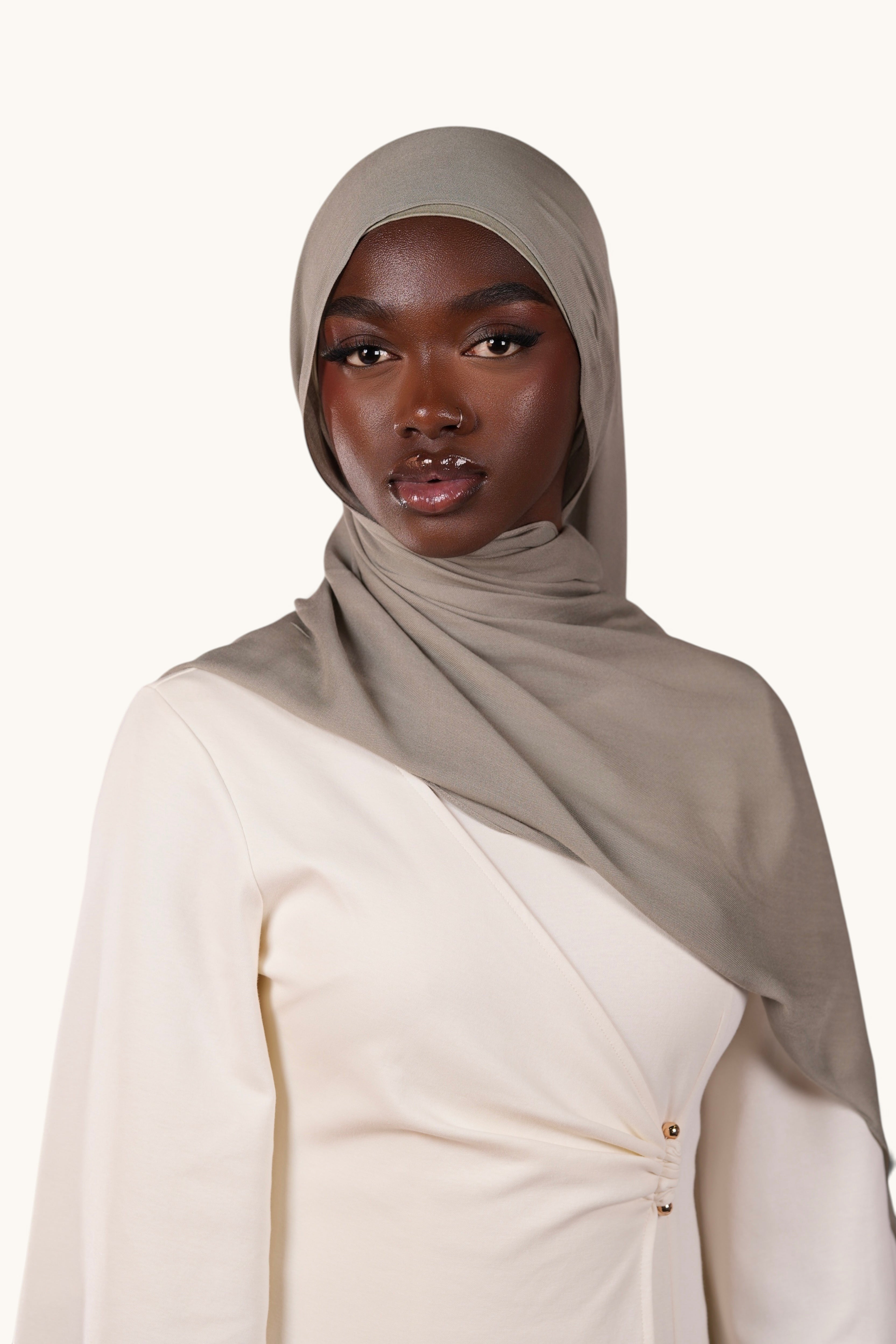 LOSYANA lightweight sage green modal hijab worn by a model with a matching undercap for an elegant flowing look
