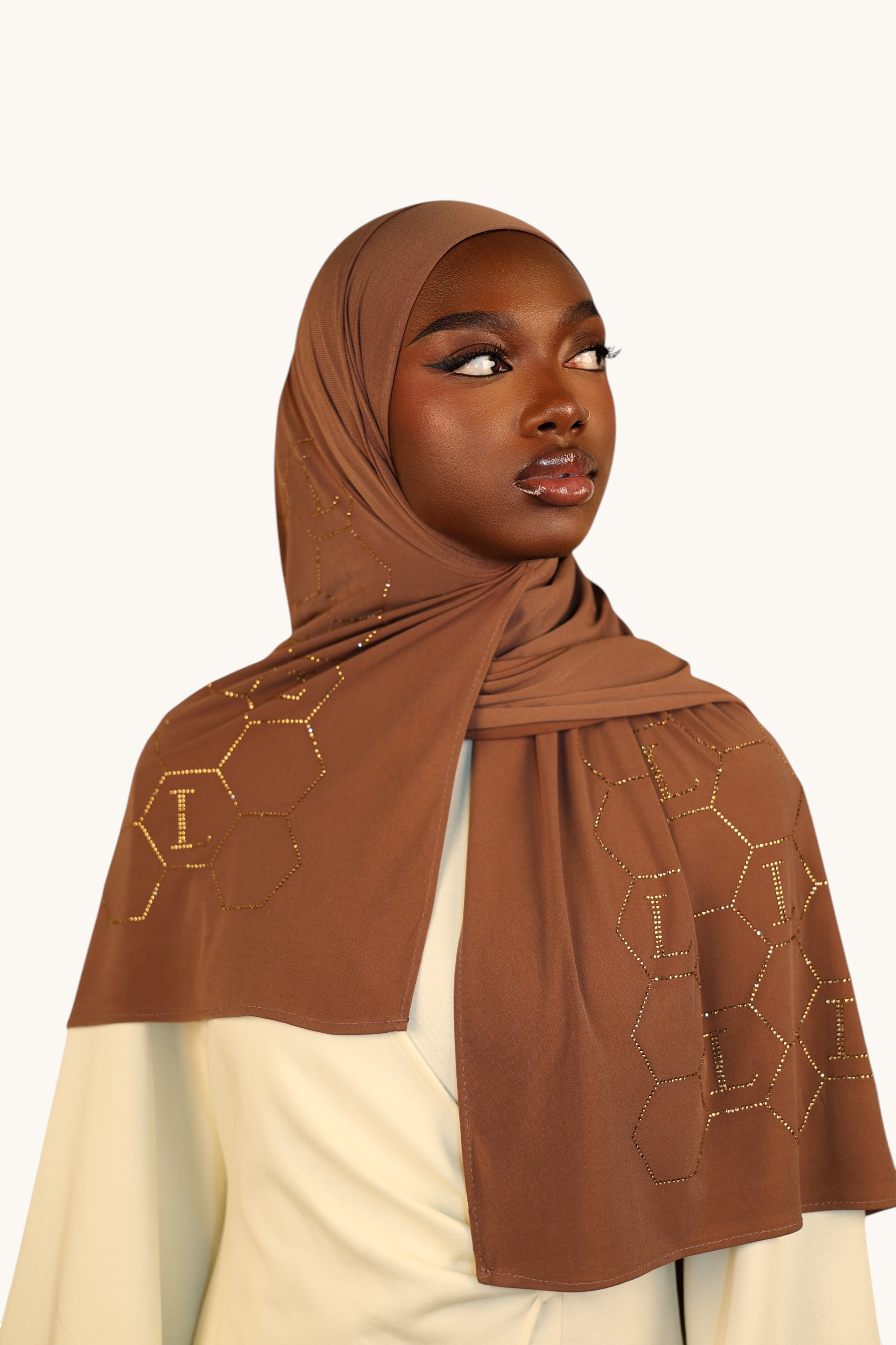 LOSYANA sahara brown premium jersey hijab featuring elegant gold rhinestone honeycomb patterns and L logo details