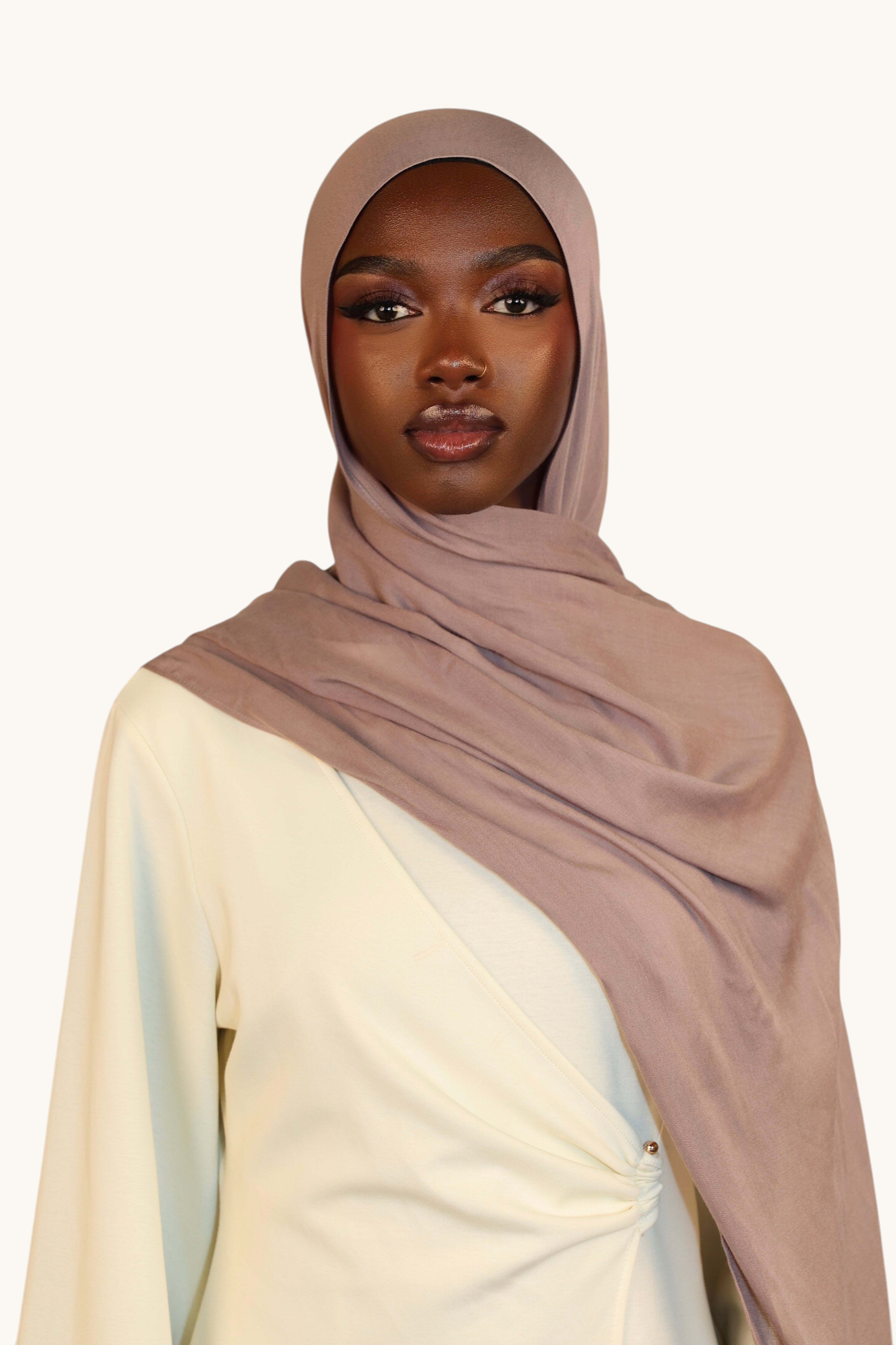 Model wearing a LOSYANA taupe gray lightweight modal hijab with a soft, elegant drape and matching undercap