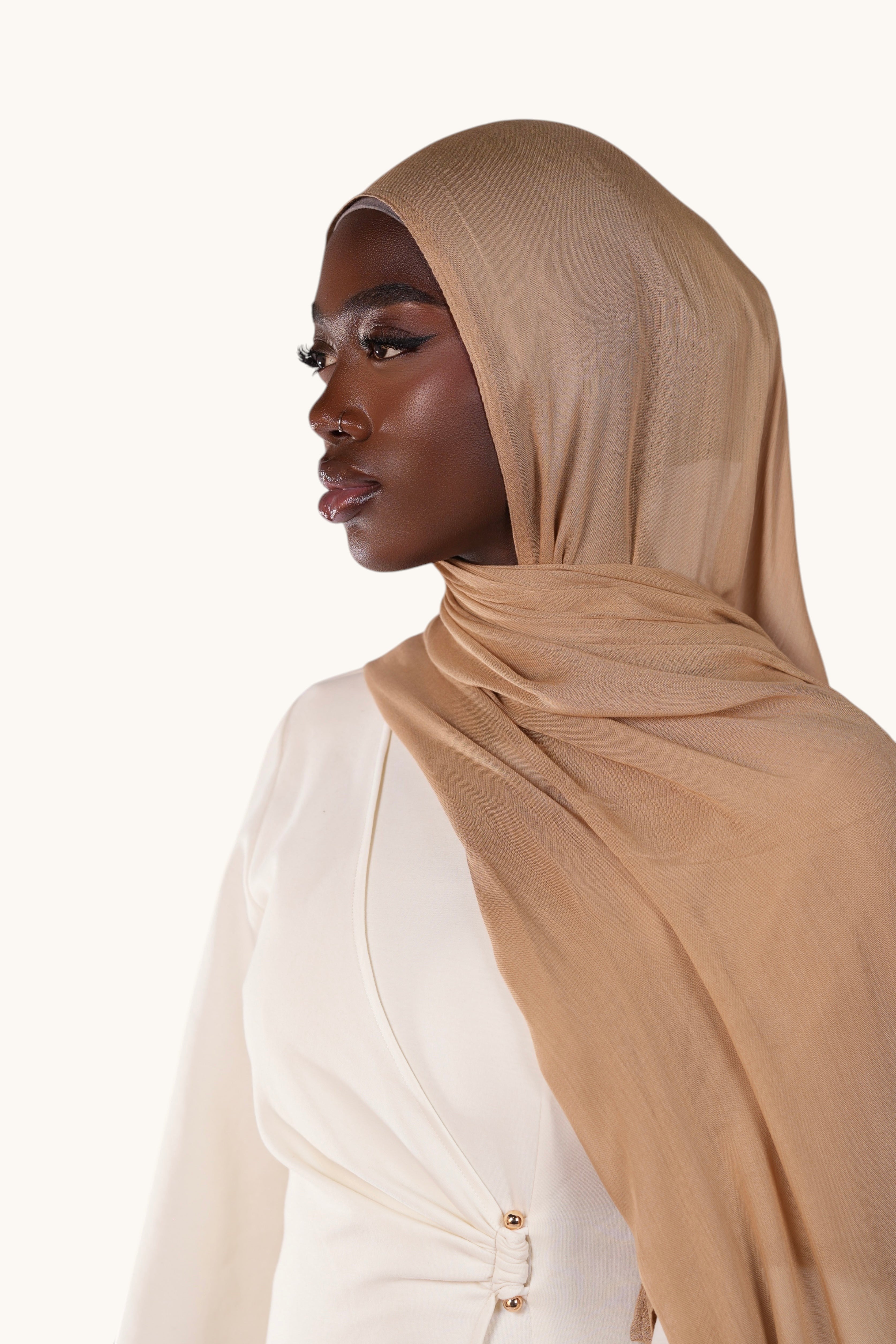 LOSYANA lightweight terracotta modal hijab worn by a model in a side profile view