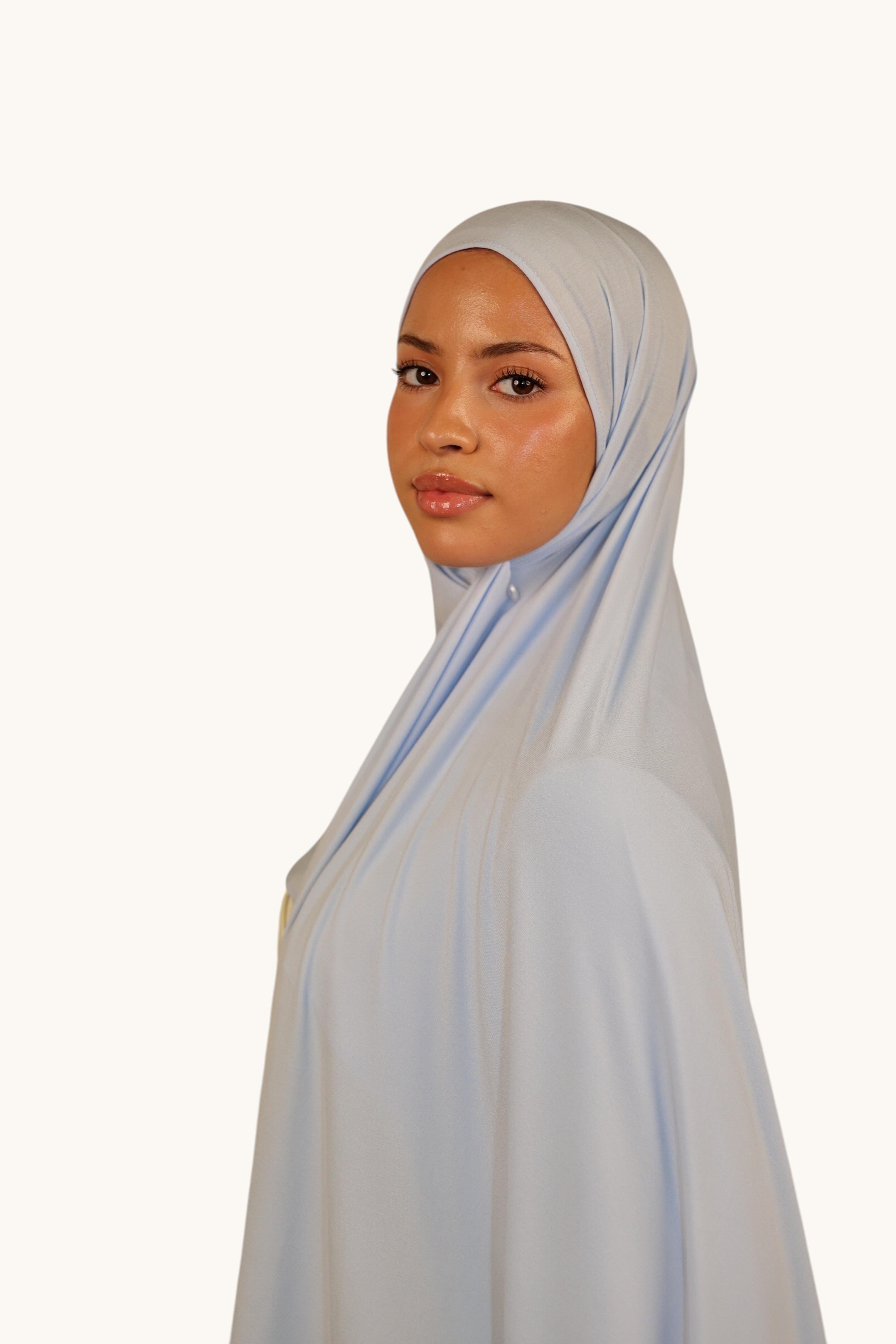 Model wearing a baby blue LOSYANA Vela Jersey hijab made of soft, lightweight, breathable fabric.