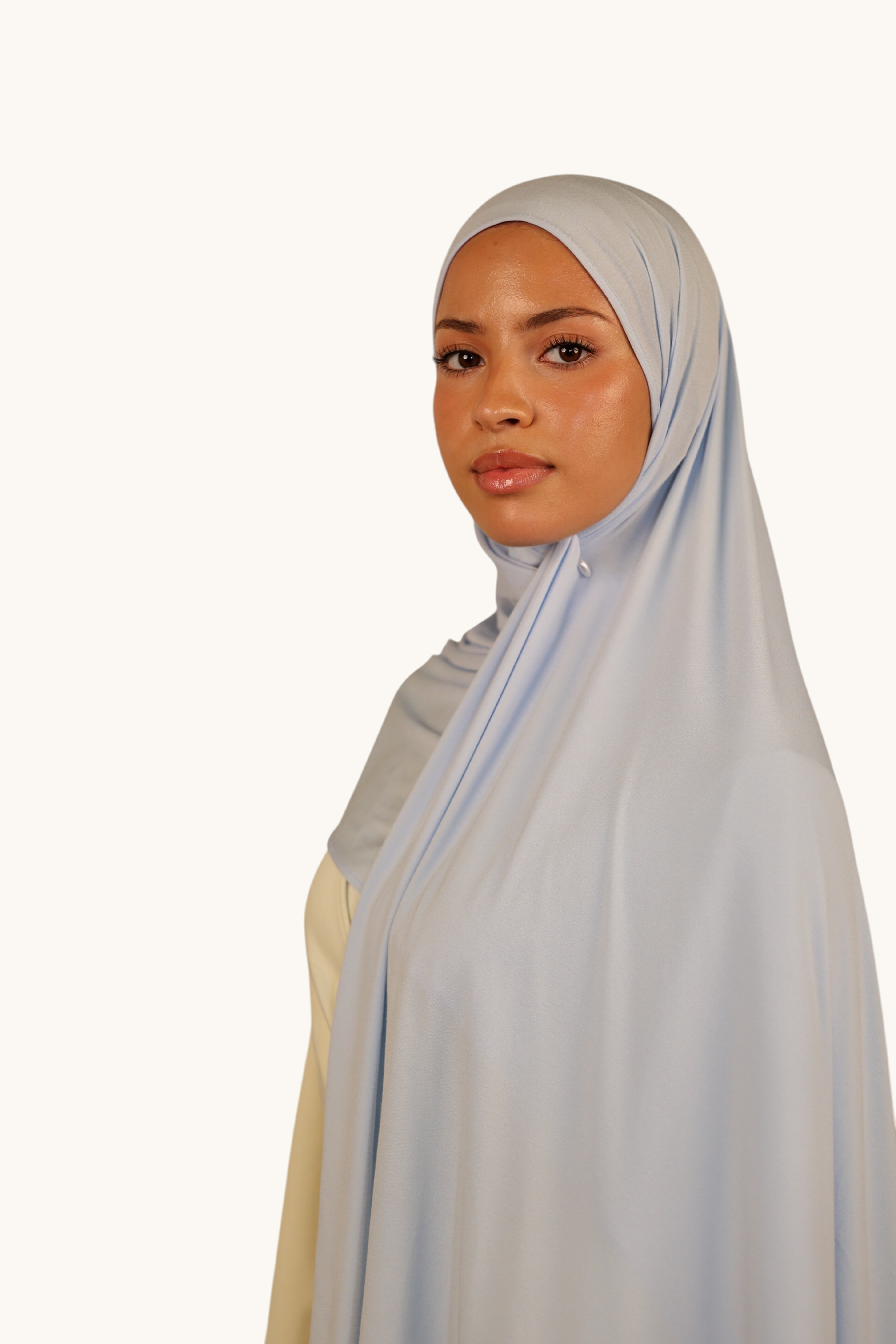 Model wearing a baby blue LOSYANA Vela Jersey hijab, featuring a soft, breathable, and lightweight fabric drape.