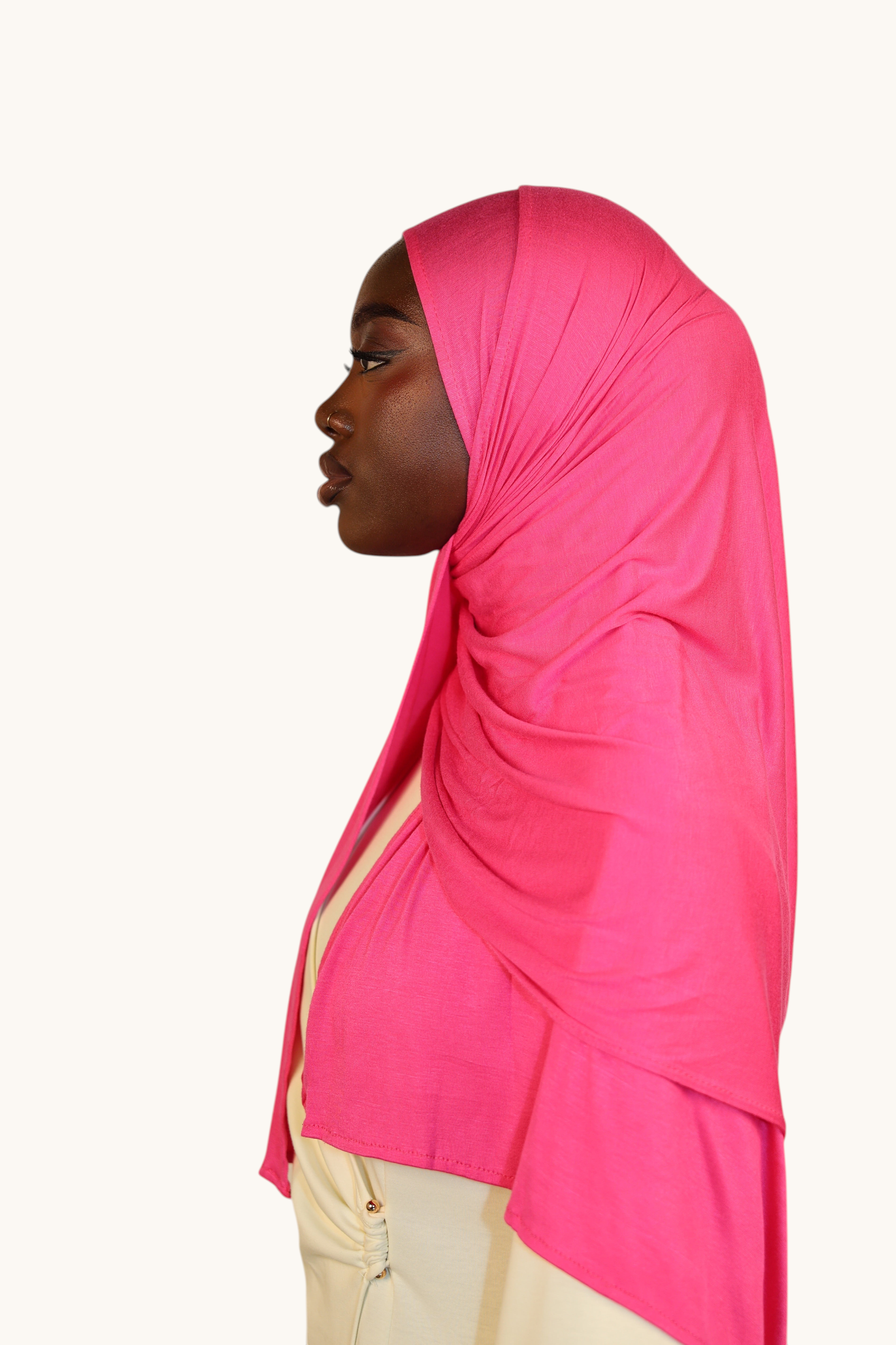 Model wearing a hot pink LOSYANA Vela Jersey hijab, showcasing the soft, breathable fabric and elegant drape.