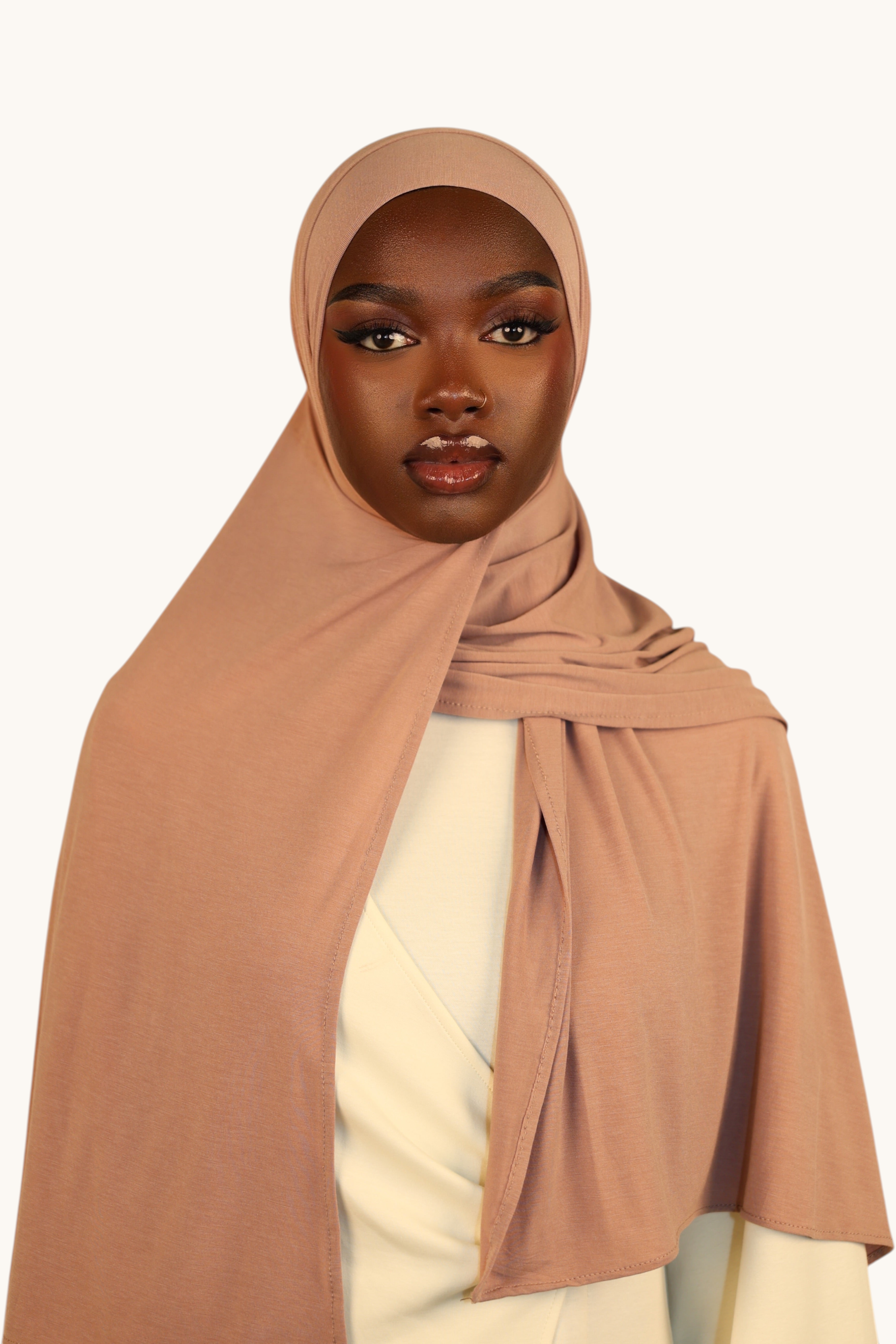 Model wearing a LOSYANA Vela Jersey in old rose, a soft, breathable, lightweight hijab styled elegantly.