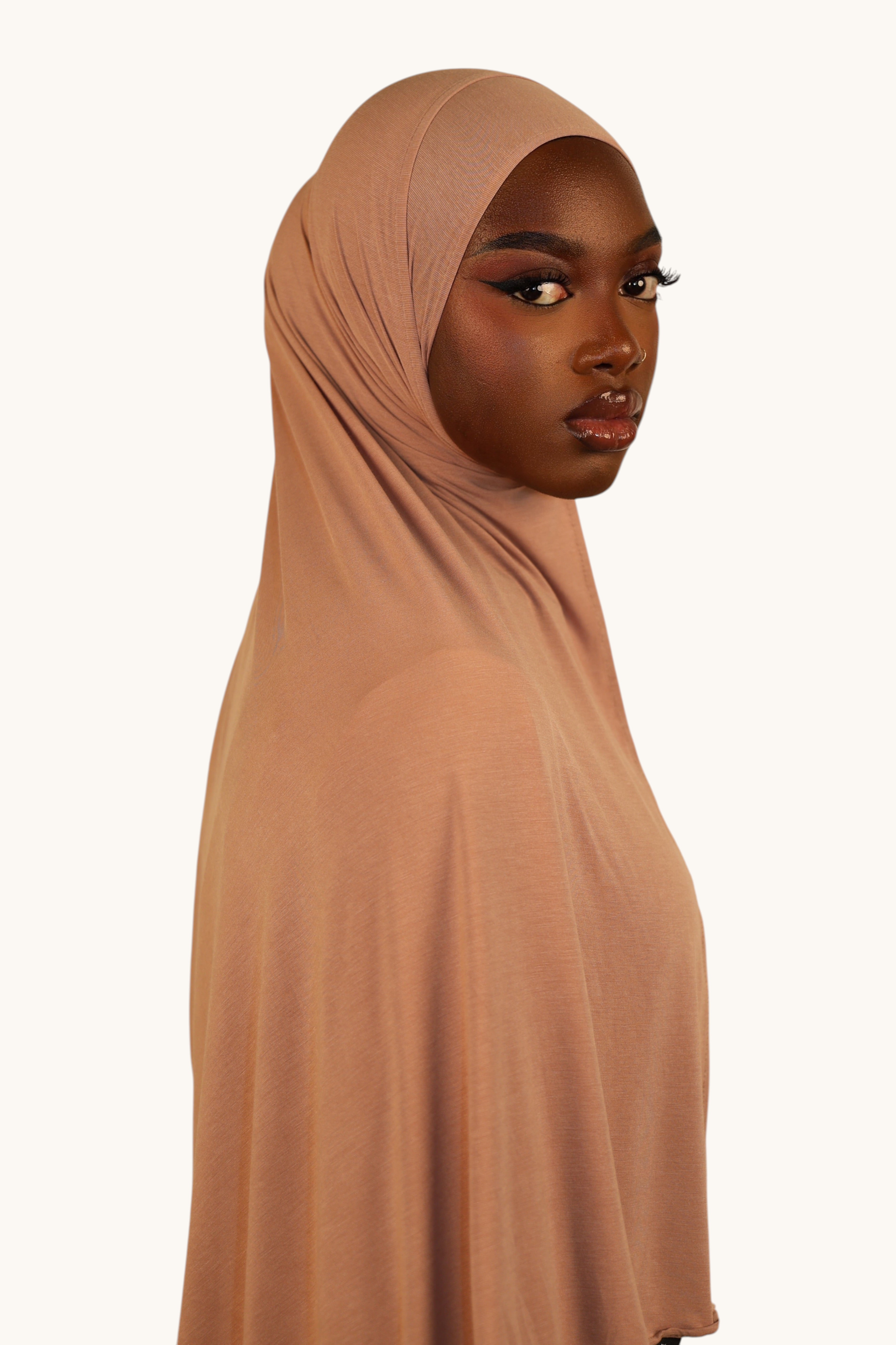 Model wearing a LOSYANA Vela Jersey in old rose, a soft and breathable lightweight fabric hijab.