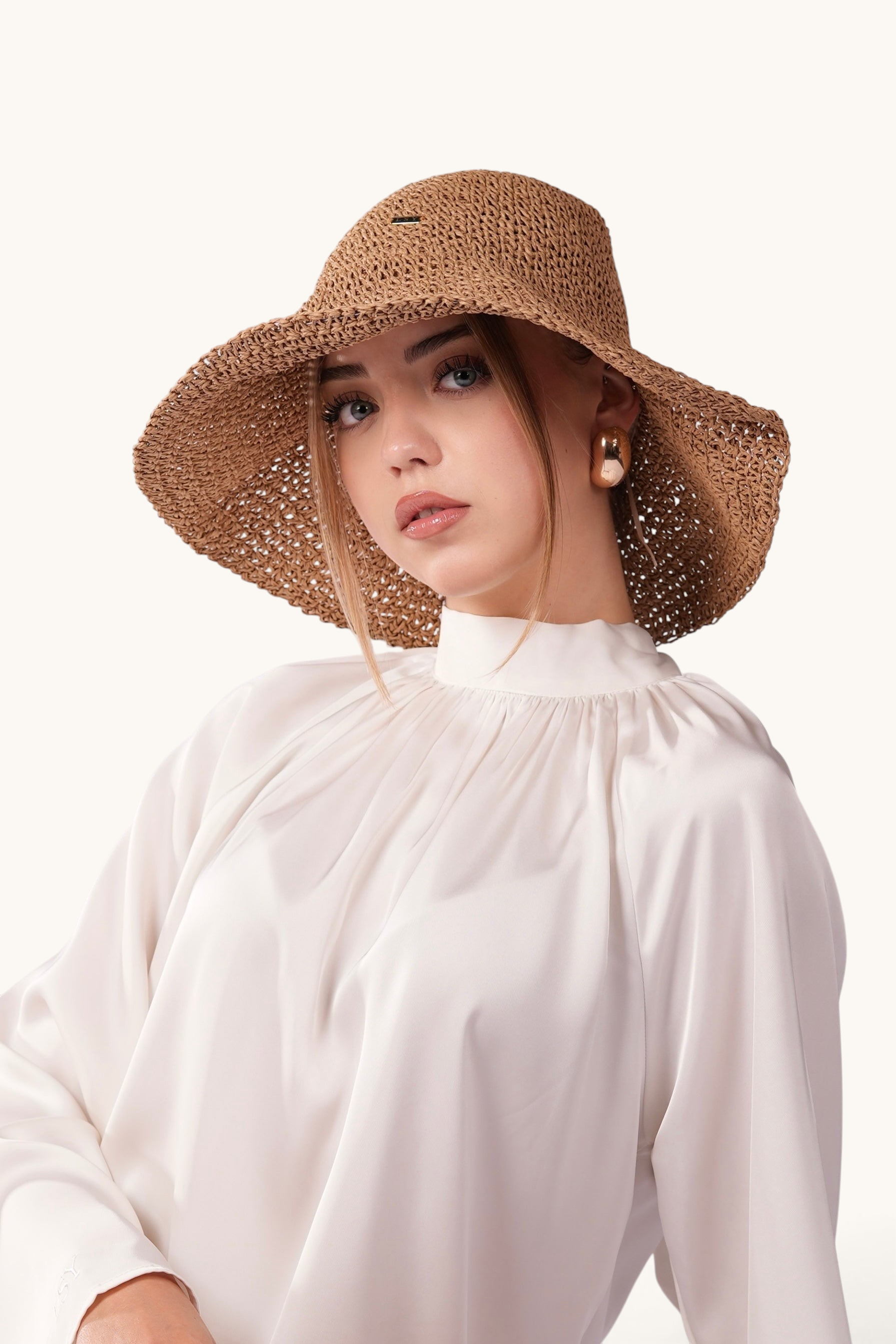 Model wearing a LOSYANA walnut straw hat with a wide, shapeable brim and adjustable fit, against a white background.